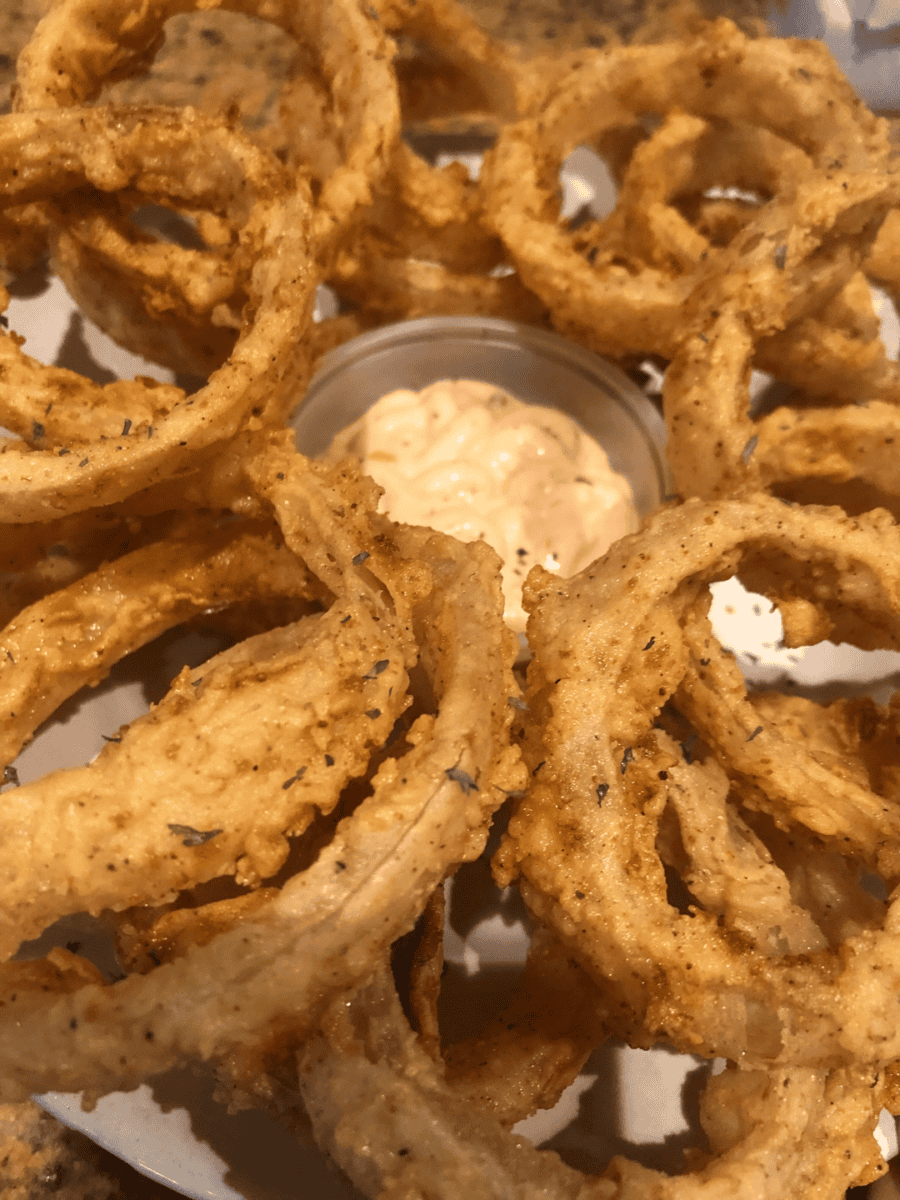 crispy fried onion rings served with dipping sauce